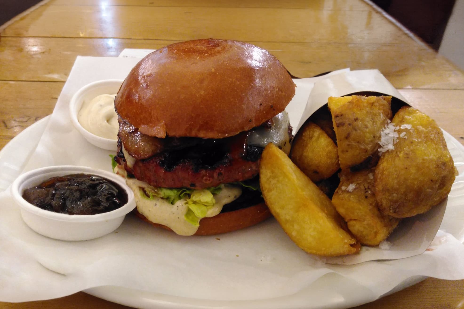 Before — Cheeseburger with potato wedges — phone photo relit to studio quality with PlateRefresh