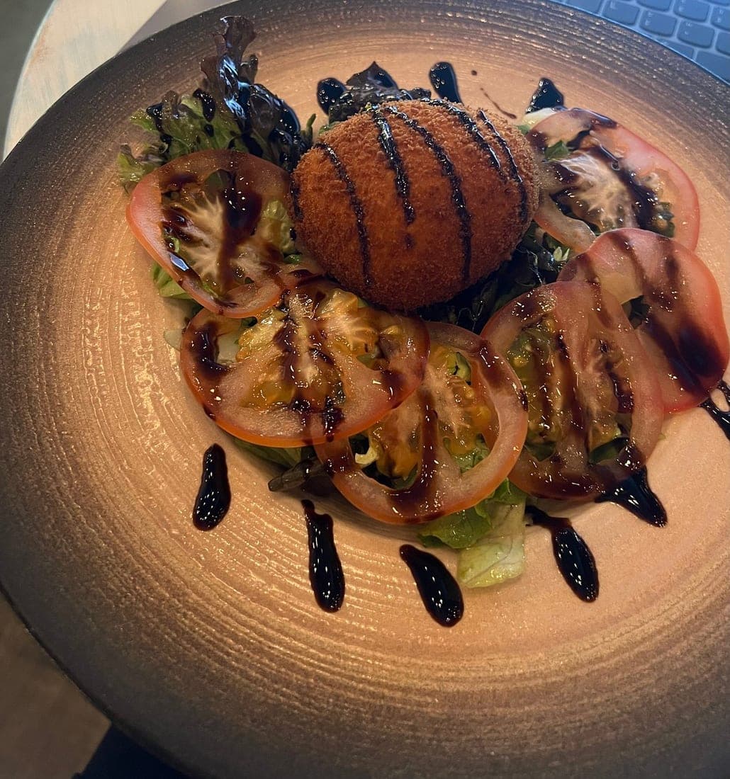 Before — Scotch egg starter — phone photo relit to studio quality with PlateRefresh