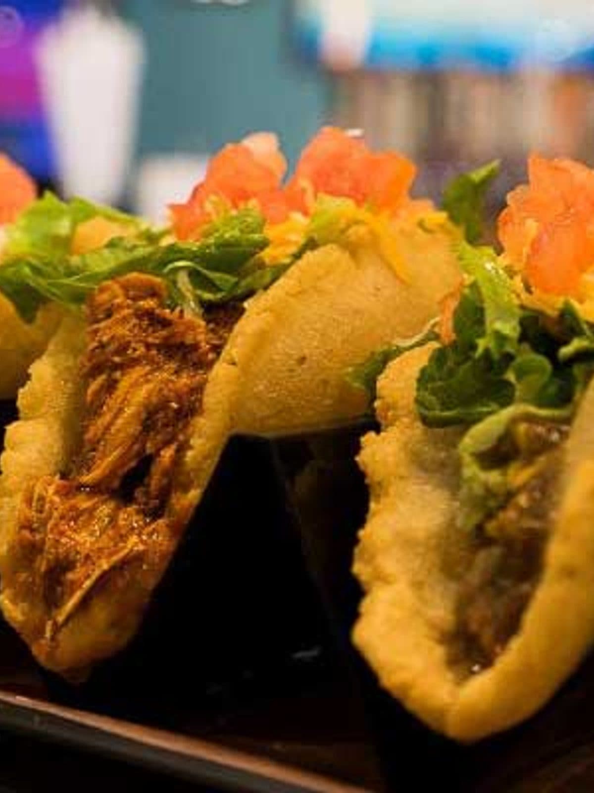 Before — Street tacos — dim phone photo relit to a bright, studio-quality delivery-menu image with PlateRefresh, the dish itself unchanged